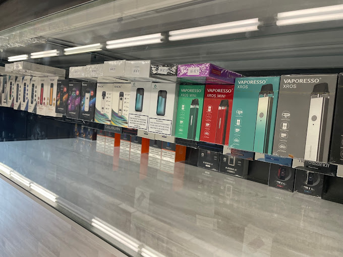 A row of electronic devices on display in a store